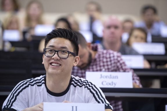 A law student sits in a lecture hall.