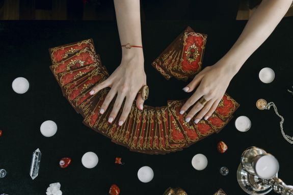 A Person Holding Tarot Cards
