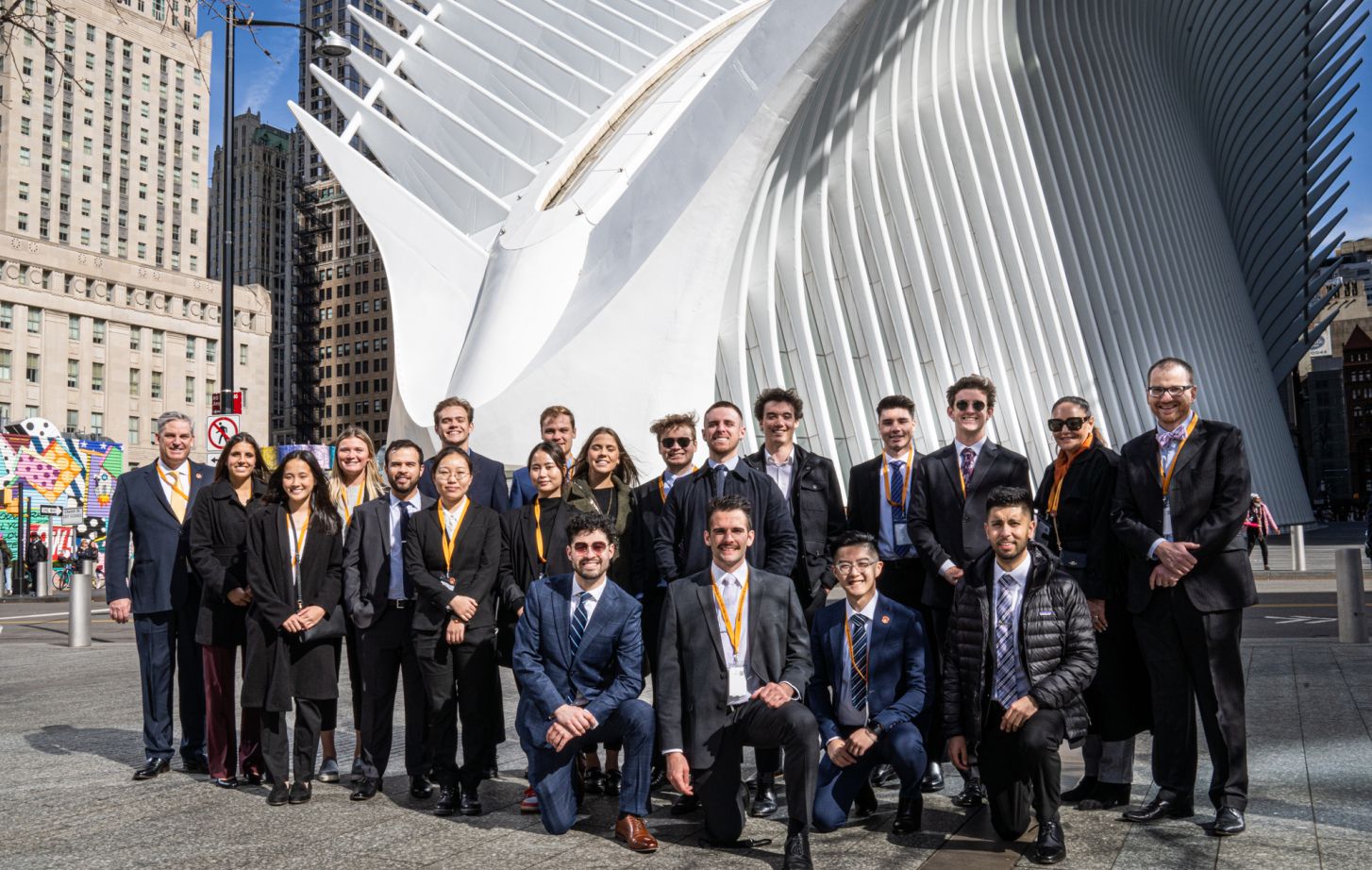 students pose for a picture on Wall Street