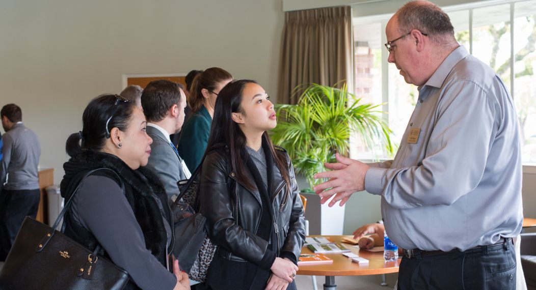 Prospective students meet with Financial Aid Director Joe Pinkas on the Sacramento campus.