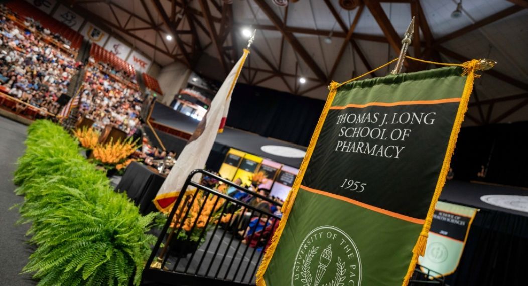Photo of the School's gonfalon at Commencement